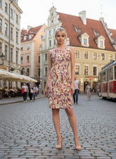 Amai dress by Blissfully Brand with colorful abstract retro-inspired floral patterns, sleeveless design, and knee-length style